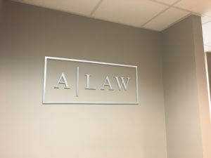 A Law Flat Cut Metal Interior Sign