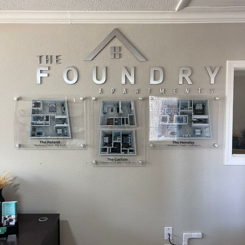 The foundry apartments interior sign and layout mockups on glass