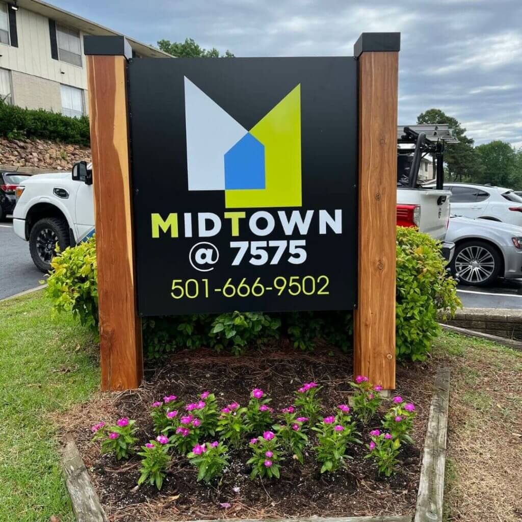 midtown apartments exterior sign with wood posts